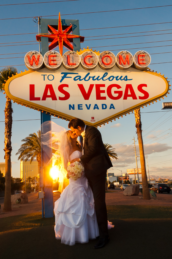 Vegas Limo Photo Tour couple in front of Vegas sign at sunset - 155 - Vegas Photo Tour -