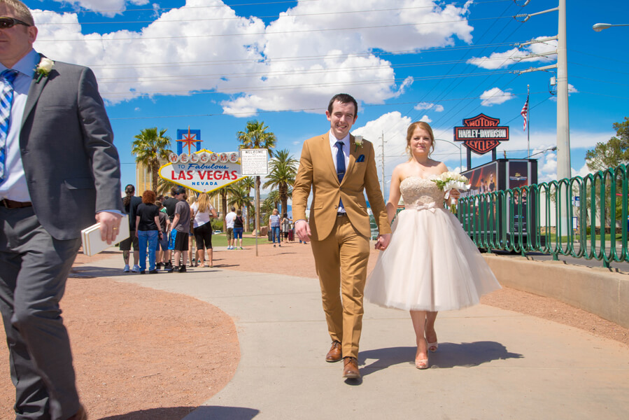 vegas limo photo tour couple walking away from sign - 135 - Vegas Photo Tour -